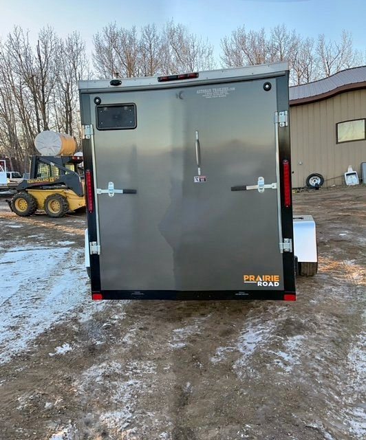 2024 New Prairie Road 6′ x 12′ v-nose enclosed cargo trailer with a ramp rear door